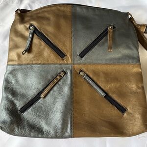 Vintage ILI patchwork leather bags feature a block design in silver and gold.
